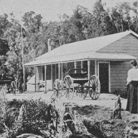 West Coast Pioneer woman in front of her house.1895.