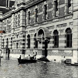 Posting letters by boat at the post office in Greymouth surrounded by floodwaters.1936-10-21.