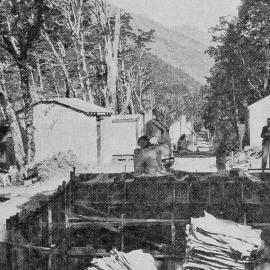 Joining Otago and Westland by a new highway: construction activity on the road over the Haast Pass. 1939.