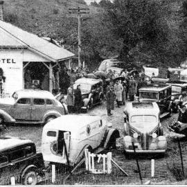 Opening of the Waimakariri River bridge at Bealey - cars and visitors at the Bealey Hotel. 1936.