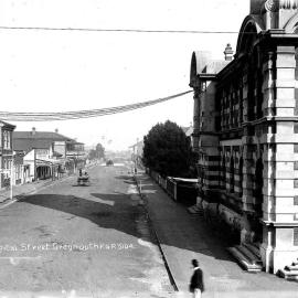 Looking down Hospital Street, Greymouth with the Post office on the corner (right); showing premises of T. Keenan, Tailor and Costumer; Public Bakery; Duke of Edinburgh Hotel.1911.