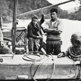 Unique method of winning gold -  A diver about to descend to the bed of the Maruia River.1932.