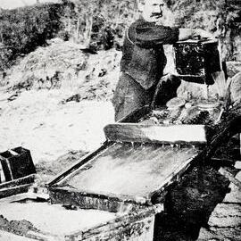 Beachcombing gold prospector on the beach at Westport.