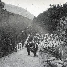 Tourists crossing a bridge in Westland.1913.