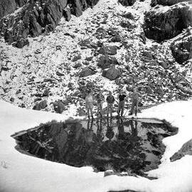 A group of trampers near a glacier during a Westland tramping trip.1950.