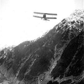 An Avro 594/616 Avian (ZK-ACM) flying over the Franz Josef Glacier in the Westland Tai Poutini National Park