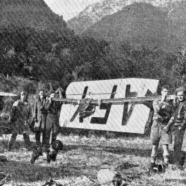 West Coast United Aero Club members carrying new wings to replace those on the plane forced down at Taipo Creek, near Moana.1939.