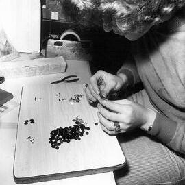 Assembling greenstone jewellery at the Westland Greenstone Co. Hokitika.