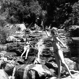 Miners on the way to the Alpine Mine, waving at girls bathing at the waterfall on Nine Mile Creek, near Greymouth.1973.