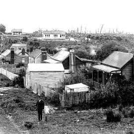 View of Side Road in Waiuta with Waiuta School building in centre back.1933.