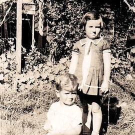 Reefton resident Grant McAlpine outside the back door of his Grandparents` house & cousin Audrey Jones.1939.