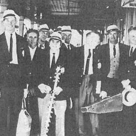 Members of the Kokatahi Band on the Hokitika Railway Station on  their way to Auckland.1969.
