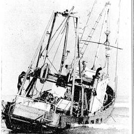 The crew of the fishing boat, Seafarer, which hit a sandbar and beached at Carters Beach, near Westport, on Tuesday night, wait for a high tide before attempting to refloat the vessel. 
