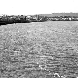 Buildings and wharves on the Hokitika River, prior to the Hokitika River Bridge being built in 1905