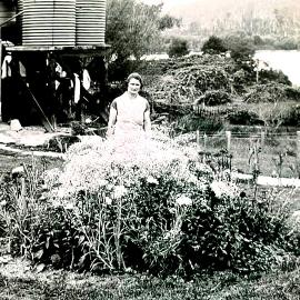Mary Millicent Winstanley (Millie) (b1897-1993) in her garden at Inangahua Junction behind her shop she had built.