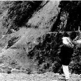Arthur's Pass resident Marie McFarland surveys the landslide and rockfalls triggerea by the earthquake. The rocks blocked State Highway 73 and the Otira River near Candys Bend
