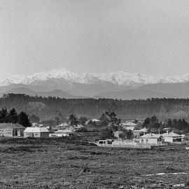 Hokitika, with snowy mountains  in distance.