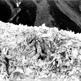 Two people traversing glacial ice, Peter Graham at right.