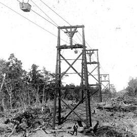 Person standing underneath a  cableway, Westland