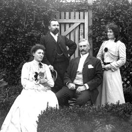 Four people in a garden, Dr Ebenezer Teichelmann of Hokitika , second from left