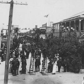 Press photographers up ladders to record procession along Revell Street for Westland Goldfields Jubilee celebration.