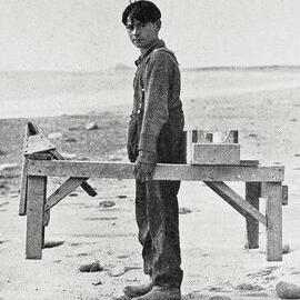  A young gold-seeker on Hunt's beach , Karangarua  -  shifting to a new claim.1933.