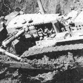 John Hotop bulldozing a bush clad spur - Haast Highway construction.1964.