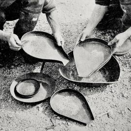 Cleaning and blowing gold at the Rimu claim.1926.