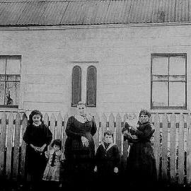 The woman holding the baby is Alice Elizabeth Morris  and the older lady is her mother outside nile st famiy home.ca.1895.