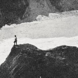 The rock on Franz Josef Glacier from which a flare is fired when a party arrives at 8 p.m. By this signal those at Waiho know that all is well, and flooded streams en route have been negotiated successfully.