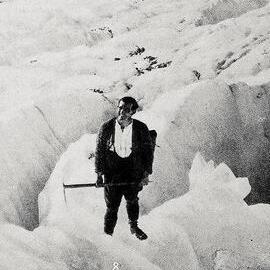  Guide Harcourt on the edge of a crevasse on Franz Josef Glacier.1928.