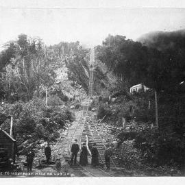 A group of people standing at the foot of the Denniston incline.