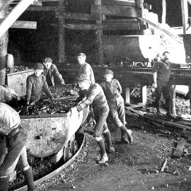 Coal wagons exiting a mine at Denniston.